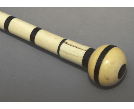 A walking stick circa 1900. Carved horn and bone section shaft and a carved ivory and ebony handle, 83,5 cm. long. Elephant i