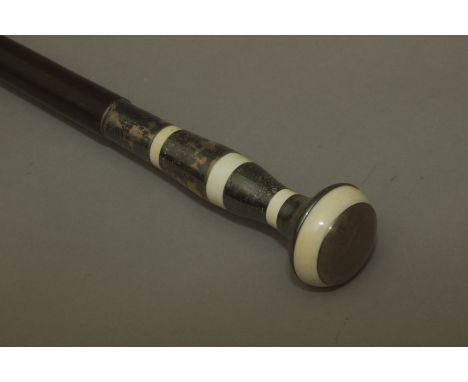 A first third of 20th century walking stick. Carved ebony shaft and a carved ebony and ivory handle, 93,5 cm. long. Elephant 