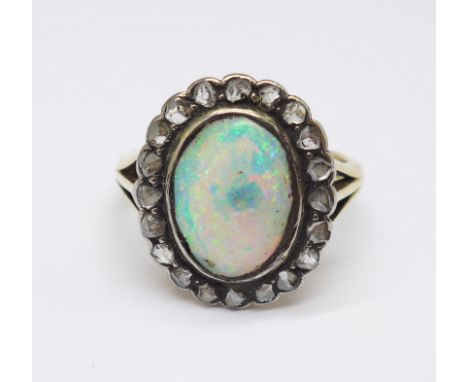 An 18ct gold, opal and old cut diamond ring, opal a/f, 6.7g, R 