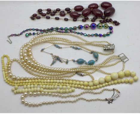 Vintage jewellery including faux pearl necklaces, two with silver clasps and a sherry amber necklace, largest bead 30mm 