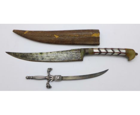 A dagger with scabbard and a souvenir letter opener marked Carcassonne 