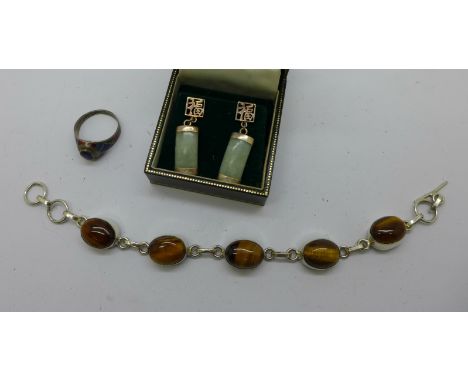 A silver and tigers eye bracelet, jade and silver earrings and a silver enamelled ring 