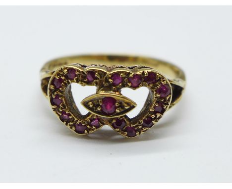 A 9ct gold and ruby 'love hearts' ring, 2.5g, M 