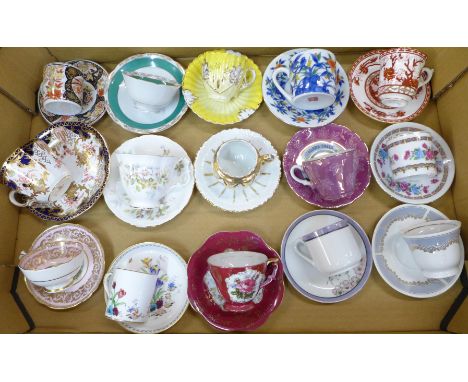 A box of decorative cups and saucers, Royal Crown Derby, Royal Staffordshire, and two teapots 