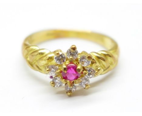 An 18ct gold, ruby and white stone cluster ring, 3.4g, L 