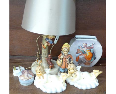 A Hummel table lamp, two Hummel figures, a Goebel pot, a figure made in West Germany, one a/f, and a Goebel vase 