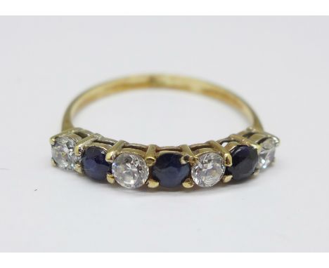 A 9ct gold, sapphire and zircon seven stone ring, 1.3g, M 