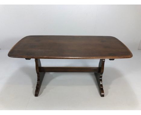 Mid century Ercol refectory table in dark wood approximately 152 x 76 x 72cm