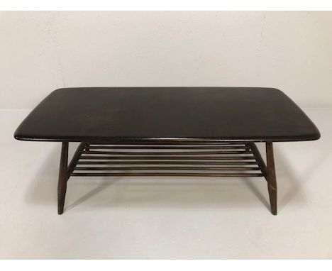 Mid Century Ercol dark wood coffee table with magazine rack, approximately 104 x 46 x 36cm