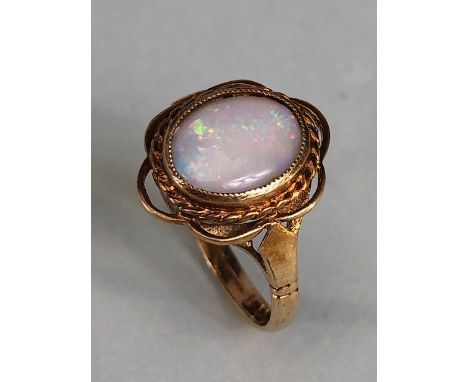 9ct gold hallmarked ring of petal design set with an oval Opal, approximately 2.7g, Size M