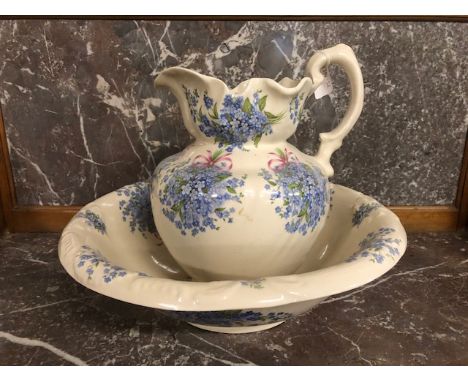 Antique Victorian Ironstone jug and basin set, the cream back ground decorated with forget-me-not flowers and bows 