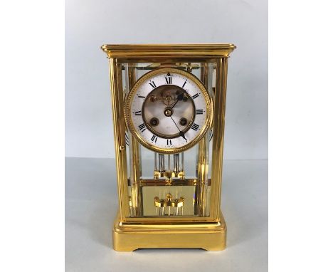 French four glass sided mantle clock with mercury pendulum movement signed A&N to movement, with white ceramic dial, exposed 