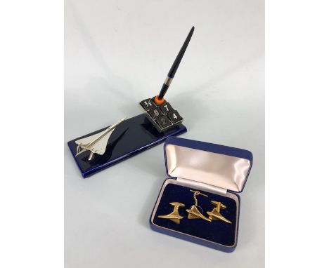 Concord interest, 1970s desk pen holder and perpetual calendar, along with a set of cuff links and matching tie clip 