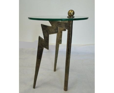 A unique solid brass and glass table, no signature.Two protruding front legs cast in solid brass as lightning bolts. The thir