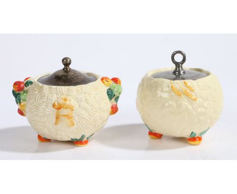 Two Clarice Cliff Celtic Harvest pattern preserve pots and coverts, the plated covers above basket weave effect exteriors wit