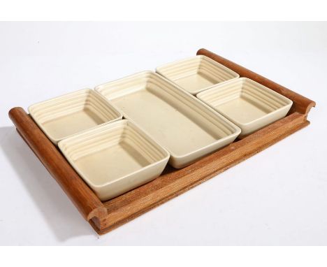 Clarice Cliff Wilkinson Ltd. hors d'oeuvres set, consisting of four square and one rectangular dish housed on an oak tray, 37
