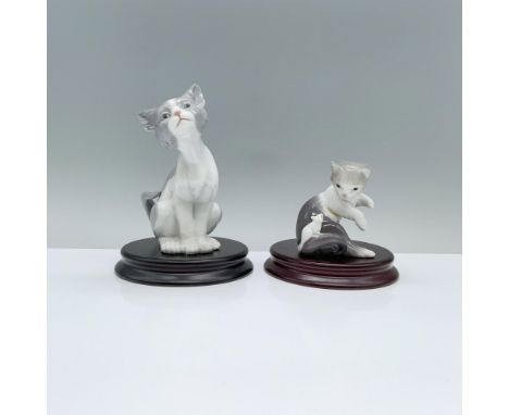 Cat 1005113 and Cat and Mouse 1005236. A gray and white cat stands attentively with its head and tailed turned to the side, w