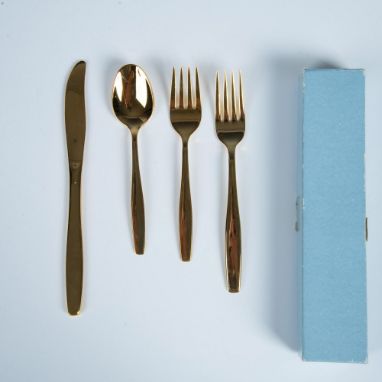 Set from the Americana Golden Heritage collection. 24K electro gold plated spoon, salad fork, dinner fork, and knife set. Rog