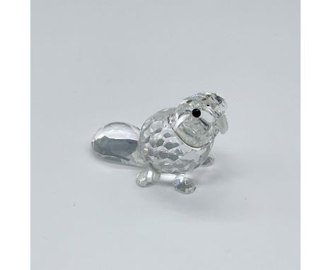 Part of the Endangered Species group. Clear crystal figural with tail flat, black eyes and frosted teeth. Swarovski backstamp