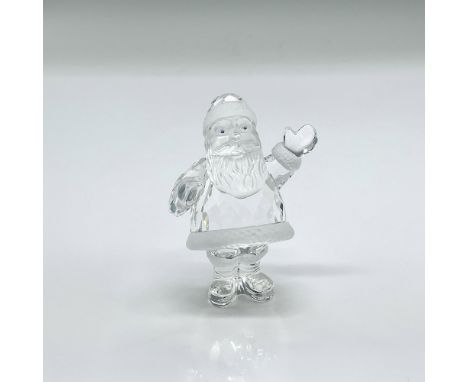 Clear faceted crystal figurine of Santa with blue eyes and frosted crystal accents. Swarovski mark. This item has its origina