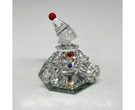 Part of the Cheerful Times group he seated wearing his crystal-clear clown outfit adorned with red, yellow and blue crystal b