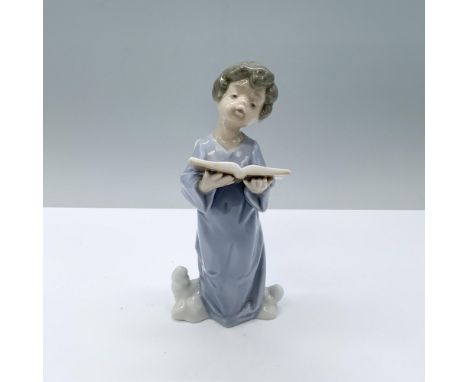 An angel dressed in a blue robe singing out of his book of songs while standing atop some clouds. Lladro backstamp. This item