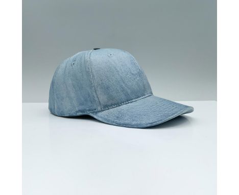 Elevate your wall decor with this ceramic wall sculpture, expertly crafted in the image of a stylish blue denim hat decorated