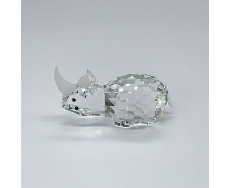 Clear crystal rhino with black eyes and frosted horns and tail. Part of the African Wildlife theme group. Swarovski etched ba