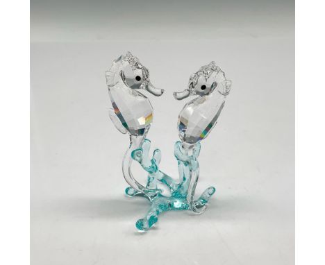 Part of the Aquatic Worlds collection, these faceted figurines have clear crystal bodies blending into light azure blue smoot