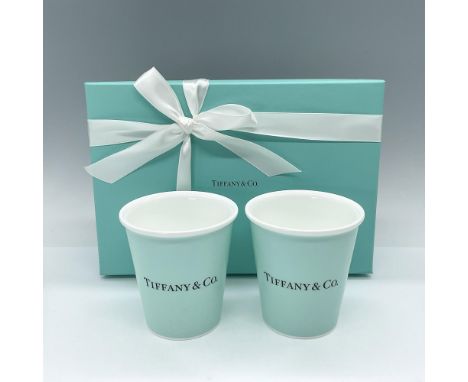 Crafted from bone china, this contemporary set of two coffee cups showcases our iconic Tiffany Blue hue, adding a touch of el