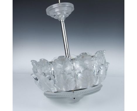 A stunning 12 elements ceiling light fixture adorned with frosted and clear glass formed as oak leaves on a chrome frame. Lal
