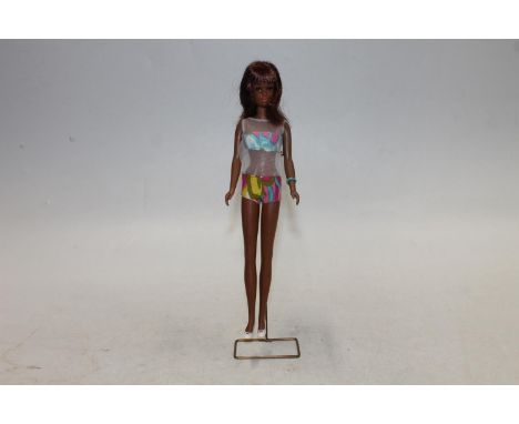 1960s Mattel Inc Toymakers Barbie doll Barbie's Cousin Francie (1966) with brown skin tone, wearing psychedelic boob tube and