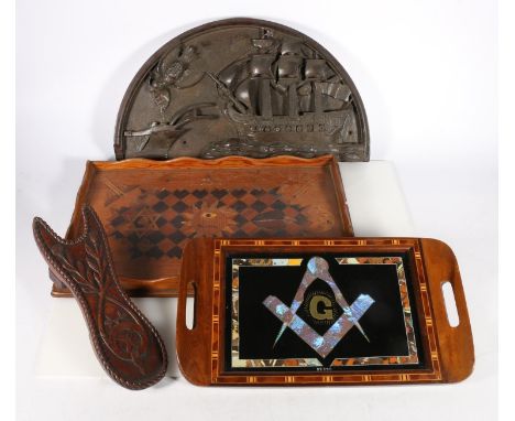 Masonic interest, a carved mahogany boot jack with thistle design, the reverse carved with Masonic compass and square device,