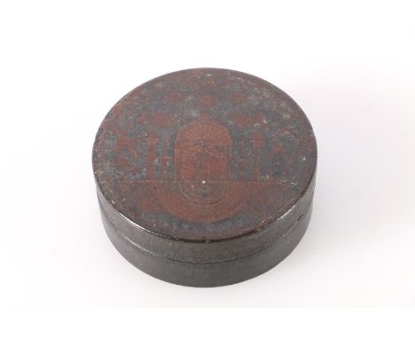 19th century circular lacquered snuff box with Masonic insignia to the top, 7.5cm diameter. 