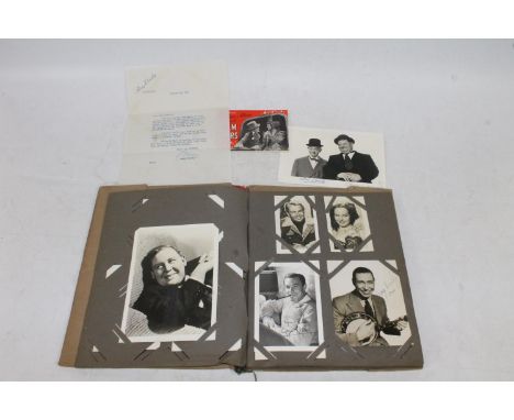 An album of stars of stage and screen photographs and ephemera to include a large photograph of Stan Laurel and Hardy Oliver 