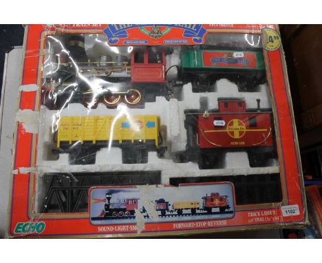 Echo G Scale twenty-piece train set boxed, and a Mamond live steam road roller. (2) 