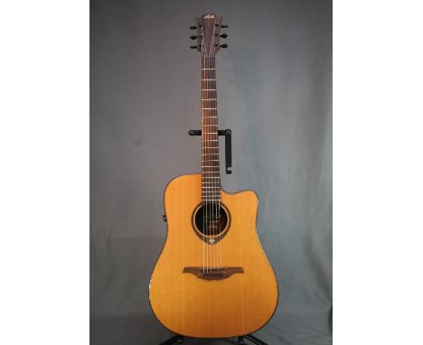 LAG Tromontone six string acoustic guitar, model number 300DCE. 