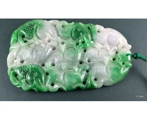 A carved Jade depicting fishes