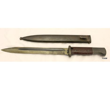 A 3rd Reich knife bayonet in its steel scabbard 16 inches overall