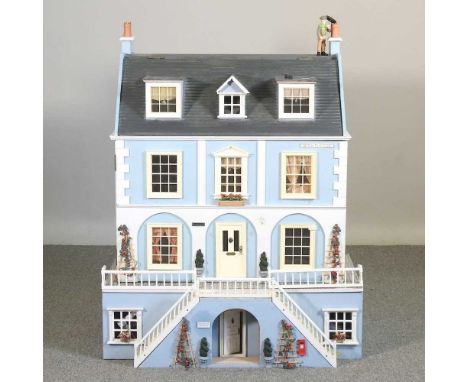 A light blue painted doll's house84w x 54d x 80h cm