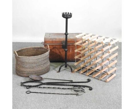 A wooden wine rack, together with a log basket, fire tools, a torchere and a metal trunk (5)