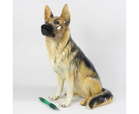 A large Beswick model of a seated alsatian, printed marks, 35cm high