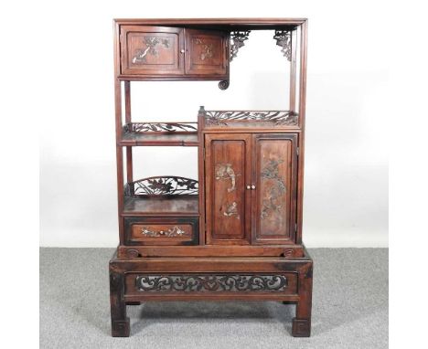 An early 20th century Japanese shibayama inlaid hardwood cabinet on stand, with fret carved decoration. Note: a non-transfera