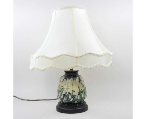 A Moorcroft pottery table lamp, decorated in the Nivalis pattern, with bullrushes, by Rachel Bishop, with a cream shade, 44cm