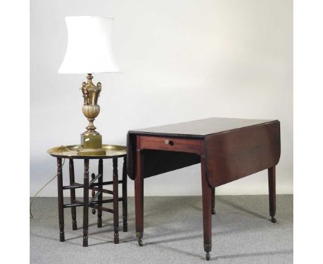 A George III mahogany pembroke table, 53cm wide, together with an Indian brass top occasional table a large brass table lamp 