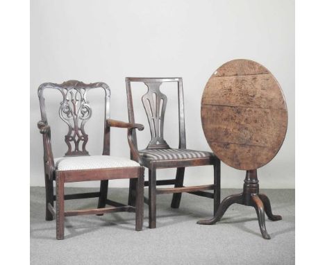 A George III carved mahogany elbow chair, together with a George III tripod table, 72cm wide and a pair of George III dining 