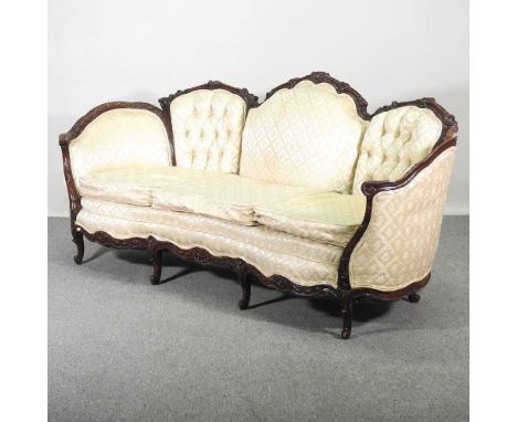 An early 20th century French cream upholstered show frame sofa, on cabriole legs198w x 89d x 74h cm