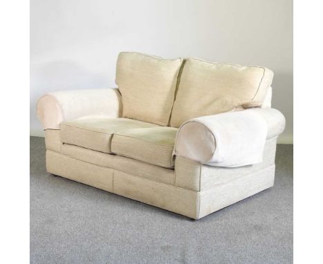 A modern cream upholstered two seater sofa144w x 90h x 90d cm