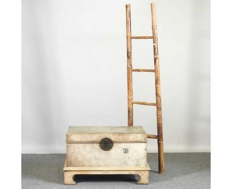 A Chinese leather trunk on stand, together with a bamboo ladder (2)76w x 52d x 45h cm