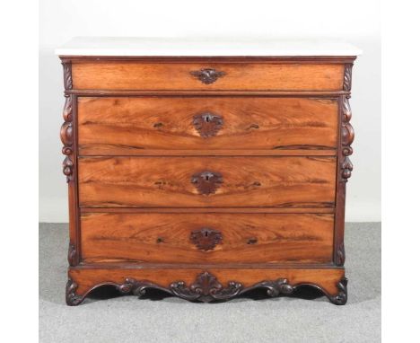 A 19th century French mahogany commode, with a marble top and scrolled decoration115w x 57d x 103h cm